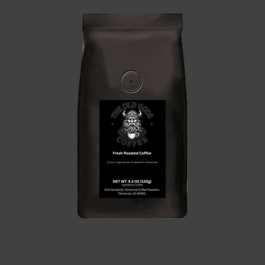 Black coffee bag with 'The Old Gods Coffee' logo on a white background