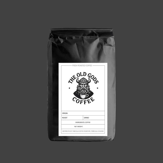 Black coffee bag with 'The Old Gods Coffee' label on a white background